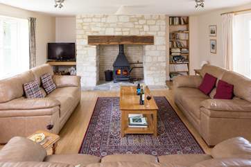 The sitting-room has views to the front of the cottage, and through double doors to the dining/garden-room.
