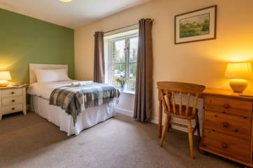 This is Bluebell, a spacious single bedroom that looks out over the front of the cottage. It has an en suite shower-room.