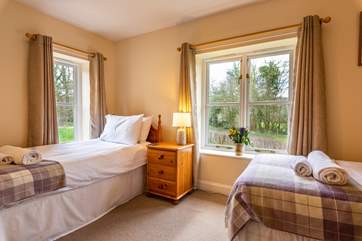This is Waxcap, which has twin beds with an en suite shower-room and views to the front of the cottage.