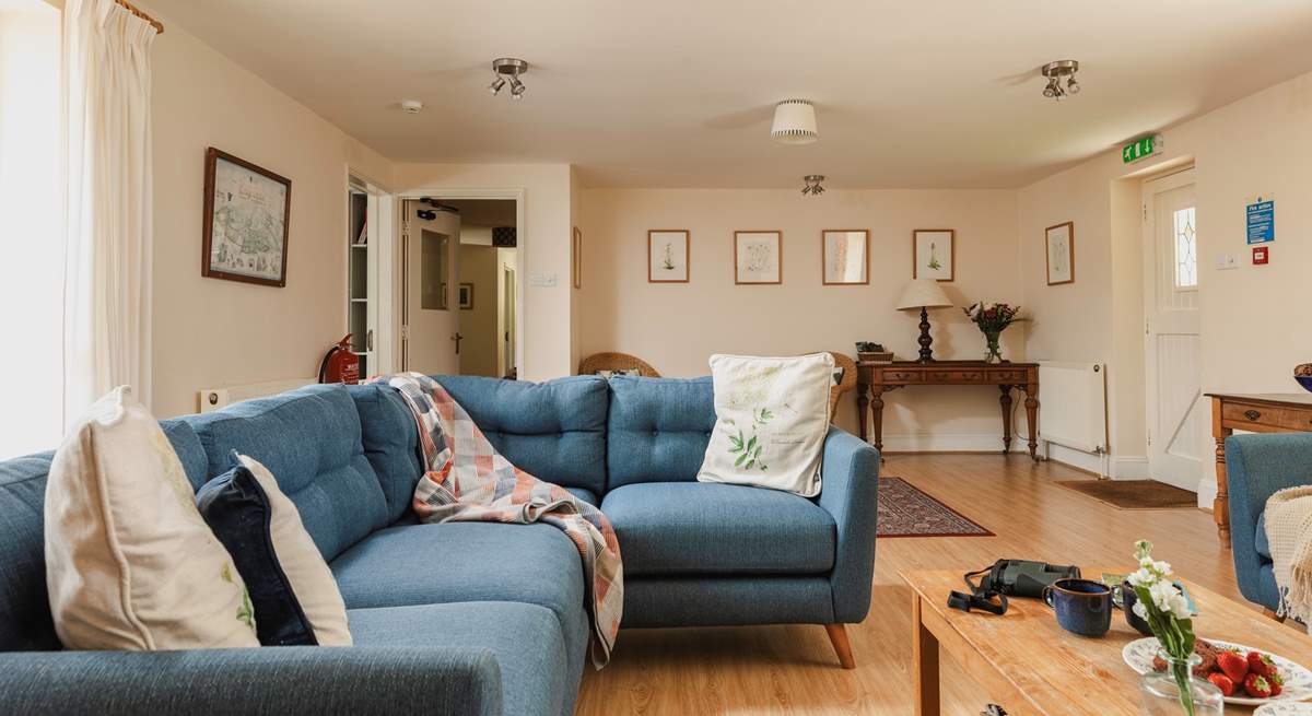 The spacious sitting-room has views to the front of the cottage and through double doors to the dining/garden-room.