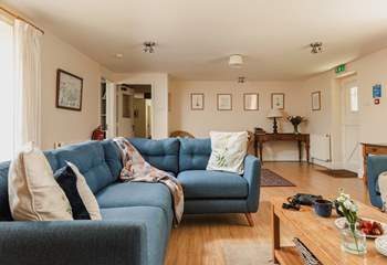 The spacious sitting-room has views to the front of the cottage and through double doors to the dining/garden-room.