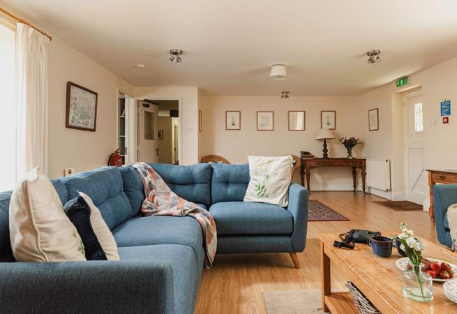 The spacious sitting-room has views to the front of the cottage and through double doors to the dining/garden-room.