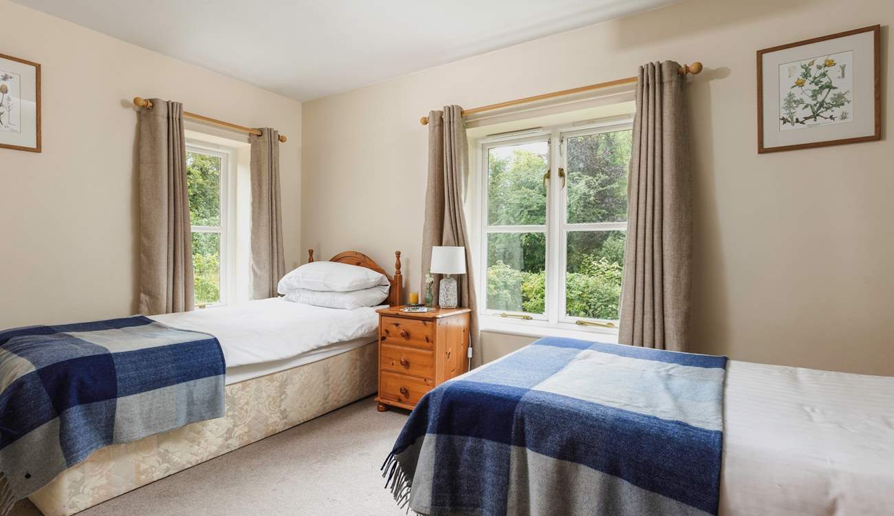 This is Waxcap, which has twin beds with an en suite shower-room and views to the front of the cottage.