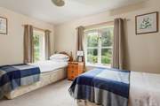 This is Waxcap, which has twin beds with an en suite shower-room and views to the front of the cottage.