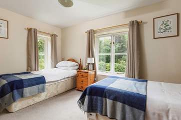 This is Waxcap, which has twin beds with an en suite shower-room and views to the front of the cottage.