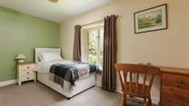 This is Bluebell, a spacious single bedroom that looks out over the front of the cottage. It has an en suite shower-room.