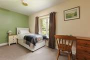 This is Bluebell, a spacious single bedroom that looks out over the front of the cottage. It has an en suite shower-room.