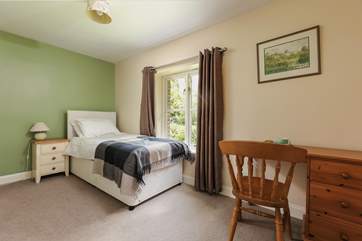 This is Bluebell, a spacious single bedroom that looks out over the front of the cottage. It has an en suite shower-room.