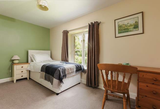This is Bluebell, a spacious single bedroom that looks out over the front of the cottage. It has an en suite shower-room.