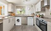 A modern kitchen creates a lovely space to prepare holiday meals. There is also an area of lowered worktop making the room accessible for wheelchair users. - Thumbnail Image