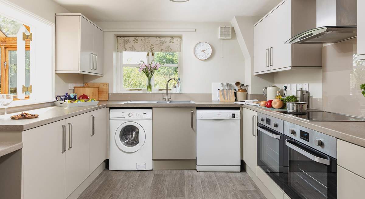 A modern kitchen creates a lovely space to prepare holiday meals. There is also an area of lowered worktop making the room accessible for wheelchair users.