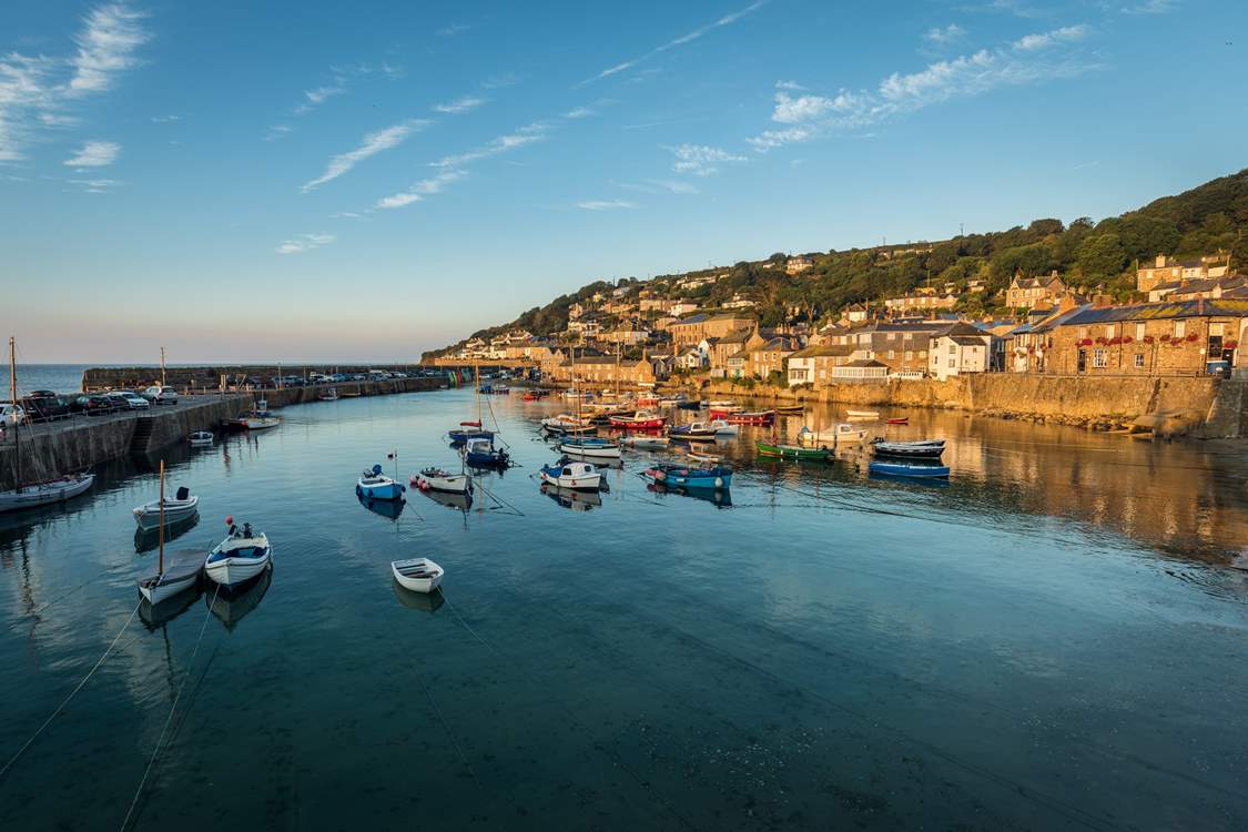The picturesque harbour village of Mousehole is just seven miles away.