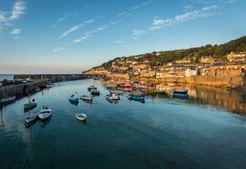 The picturesque harbour village of Mousehole is just seven miles away.