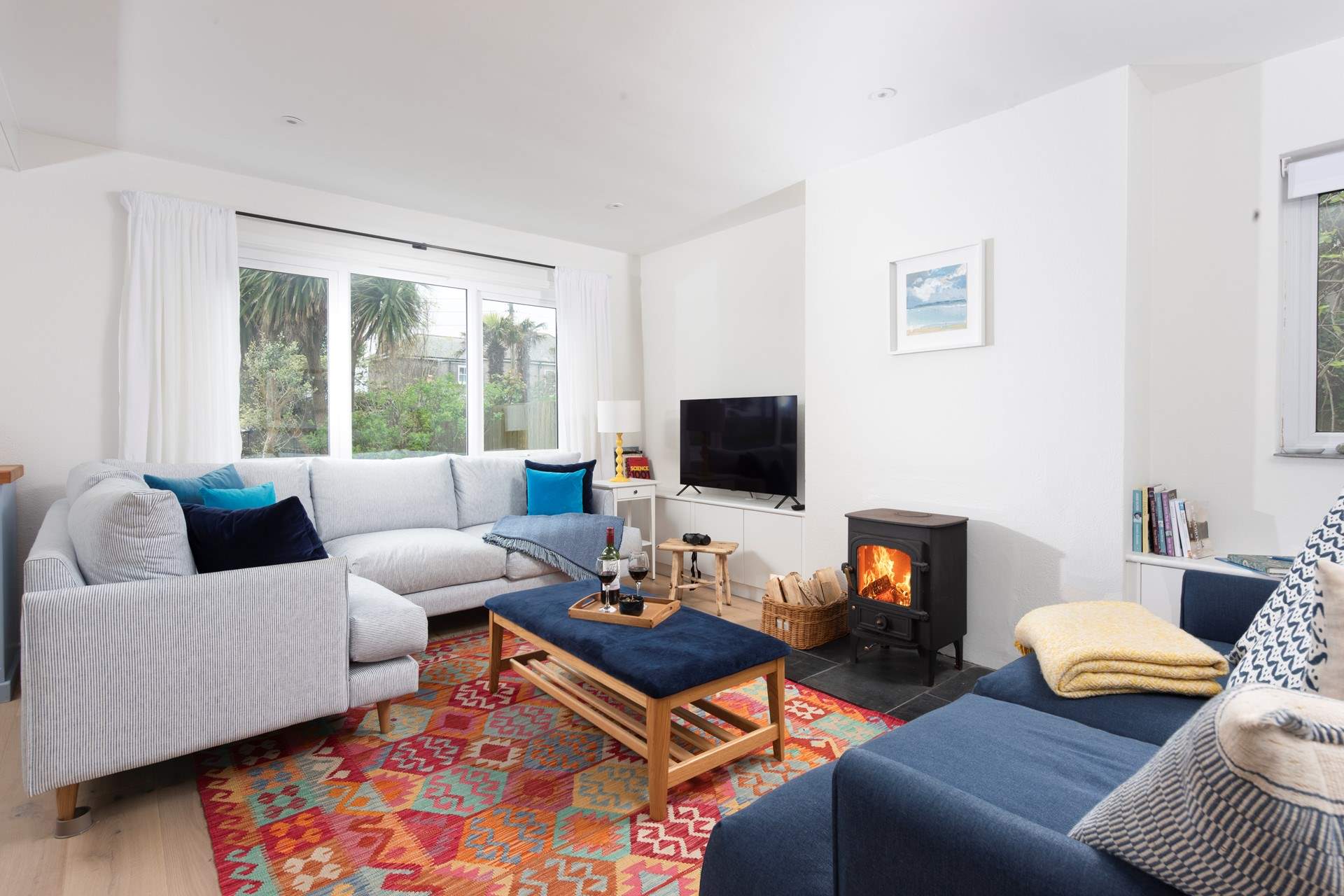 Snuggle up on the deep filled sofas by the cosy wood-burner.