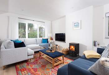 Snuggle up on the deep filled sofas by the cosy wood-burner.