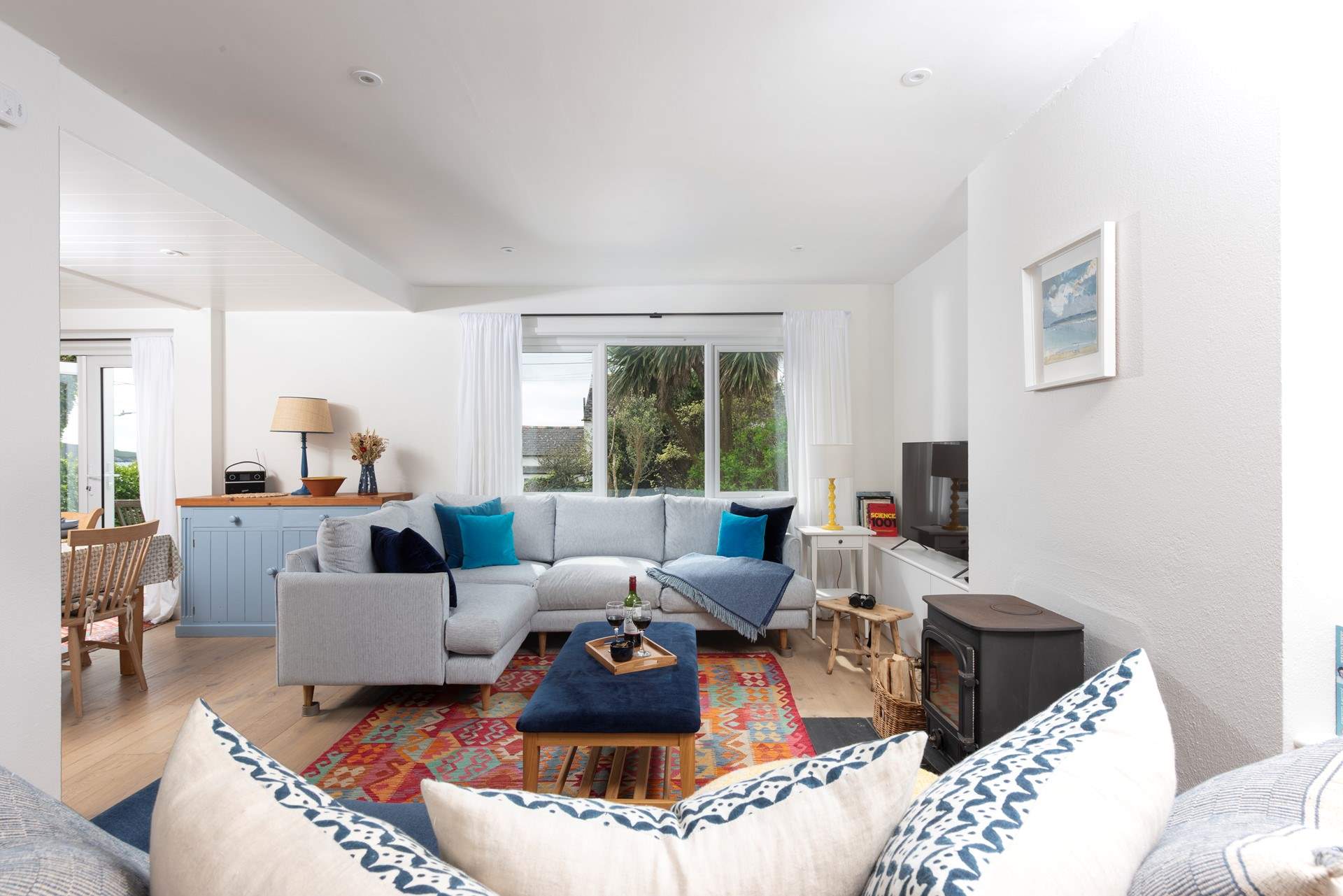 The huge windows fill the home with light.