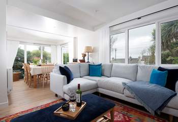 With sea views in the distance, the sitting/dining-room provides the perfect spot to gather the family.