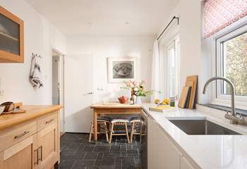 The kitchen also has a dining area in addition to the large dining table in the open plan sitting room.