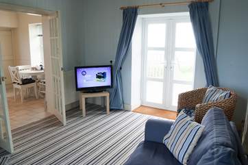 The sitting-room with French doors out onto the private patio and garden.
