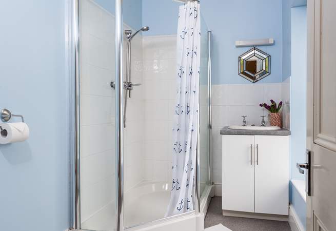 The en suite shower-room has a large corner shower cubicle, and also enjoys the view.