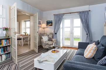 The sitting-room with French doors out onto the private patio and garden and dine with a view from the kitchen/diner.