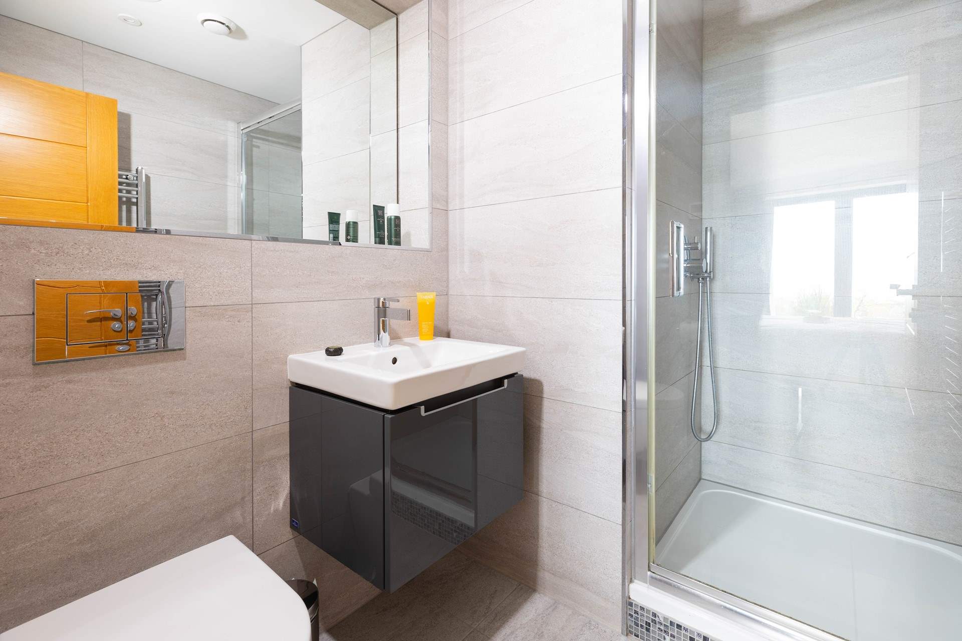 Power shower, mood lighting, floor to ceiling tiling - a rest room to refresh.