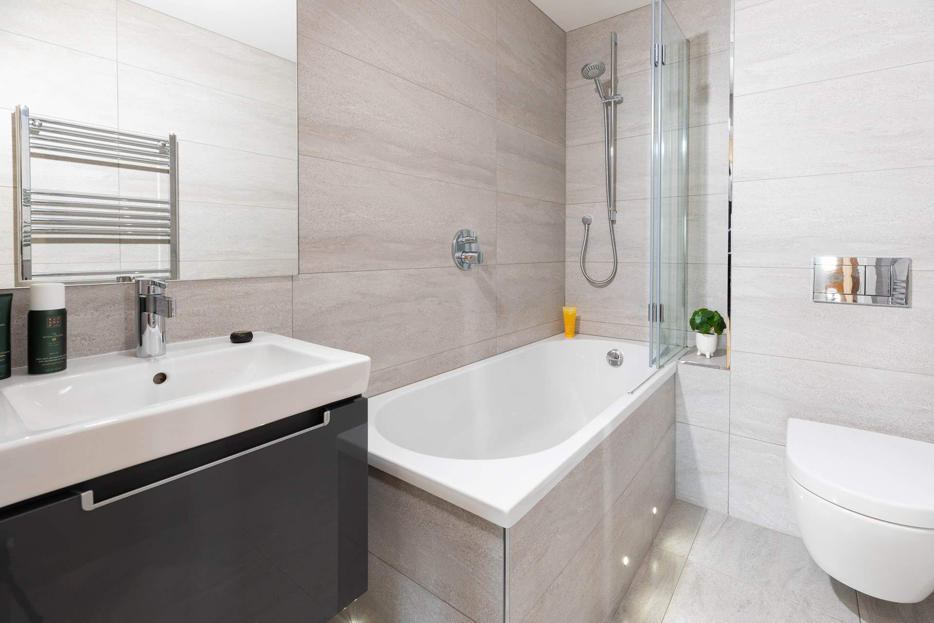 A spacious family bathroom, soak away the day in this elegant bathtub.