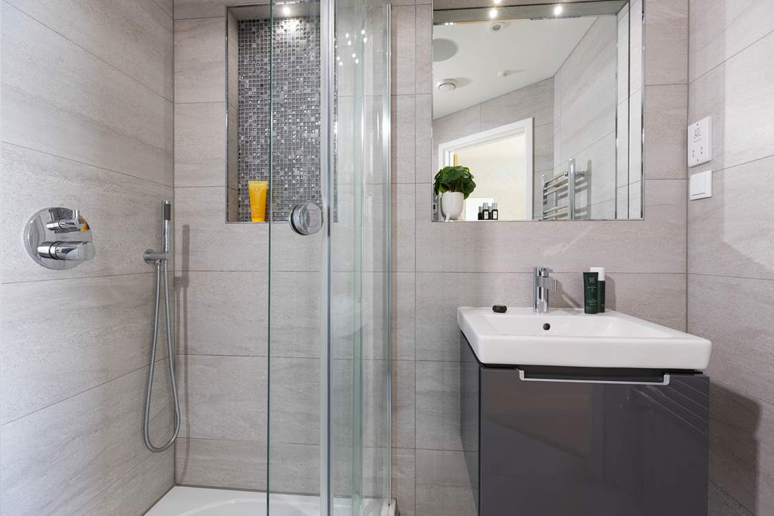 Refresh yourself under the rainfall shower in the sleek en suite bathroom.