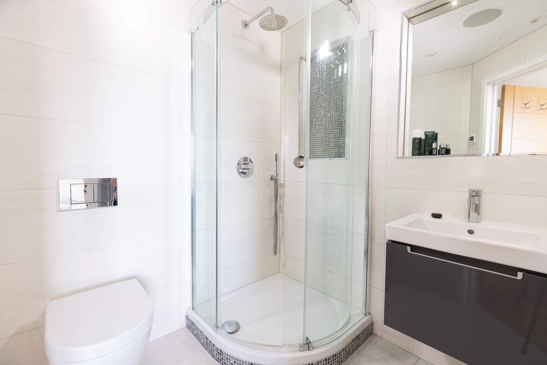 The en suite complete with power shower and modern lighting.