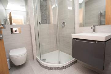 The en suite shower-room includes a large corner shower cubicle.