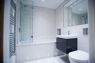 The stylish bathroom with wall hung wash-basin, bath and WC from Villeroy and Boch.