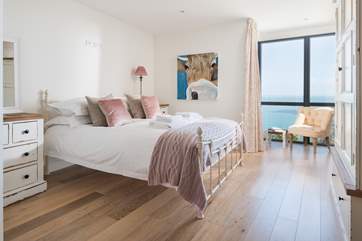 The gorgeous main bedroom is oh so pretty in pink.