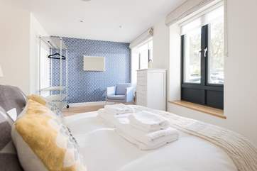 Bedroom two is calm and cosy.