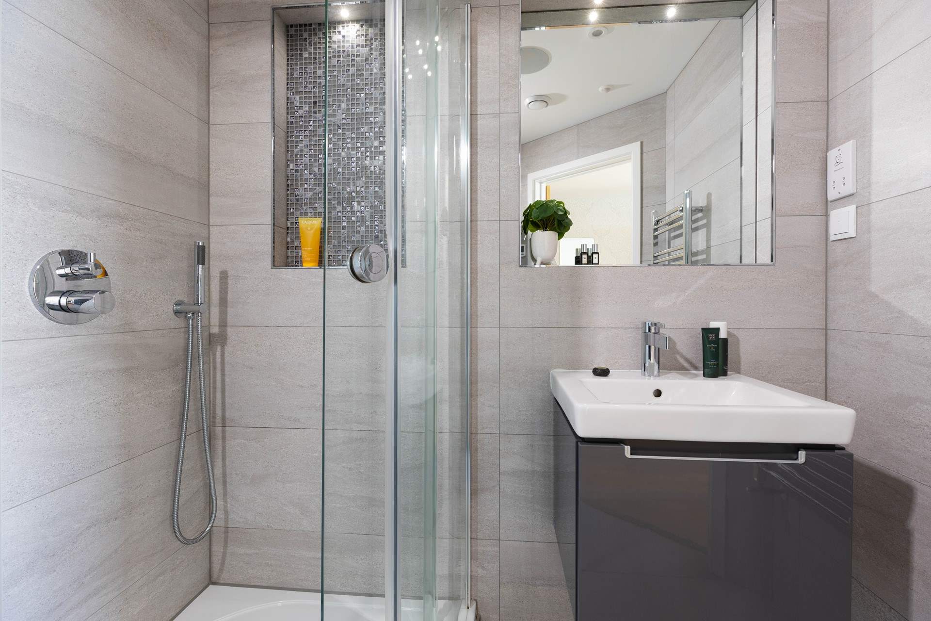 The functional en suite with power shower in bedroom 1.