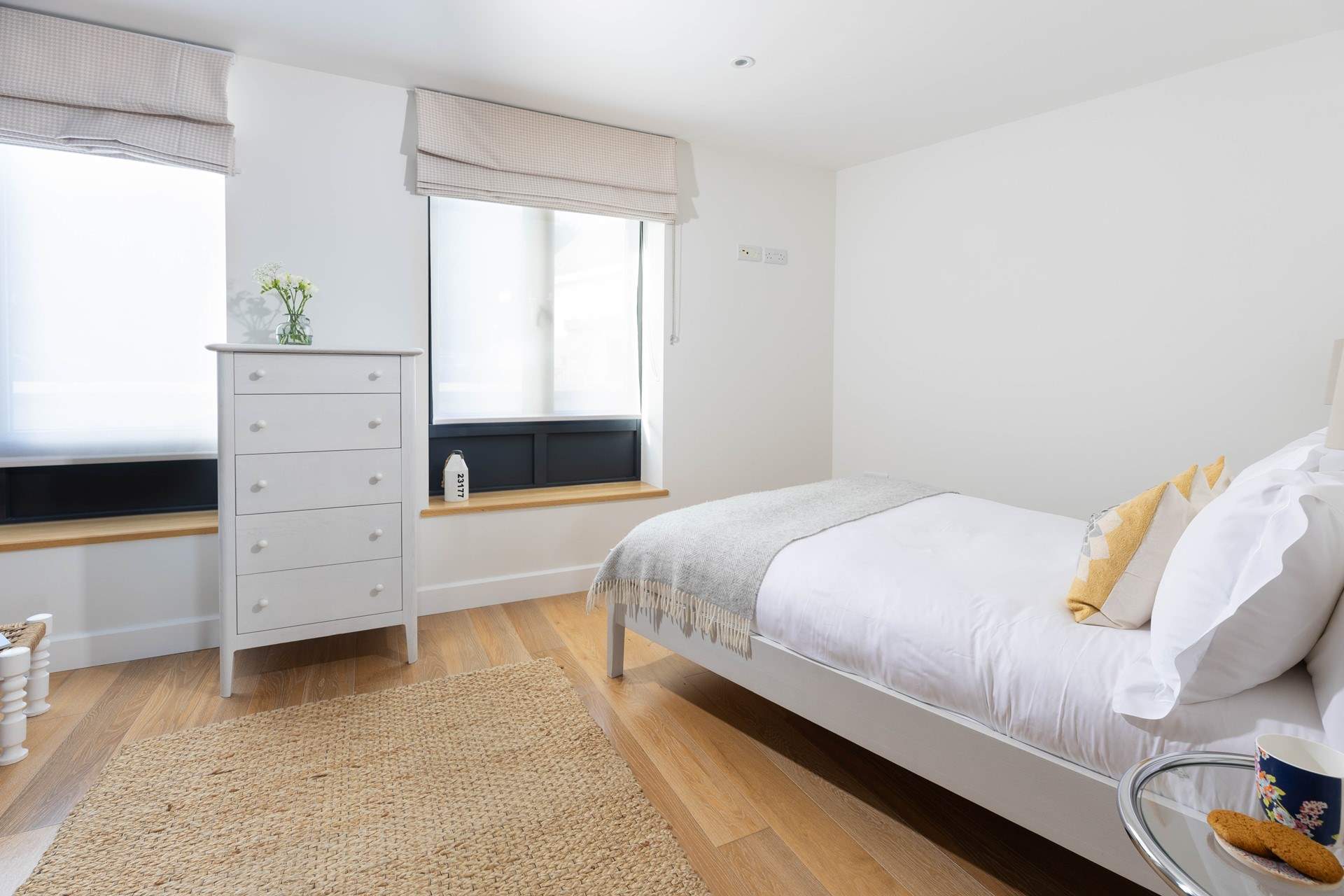 Bedroom 2 faces the private car park but the modern blinds offer complete privacy.