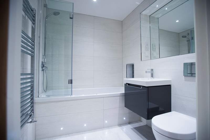 The gorgeous bathroom with Villeroy and Boch bath, wall-mounted wash-basin and WC.
