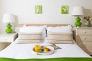 Centre stage in bedroom 1, the plush king-size bed, dressed in luxury linens.
