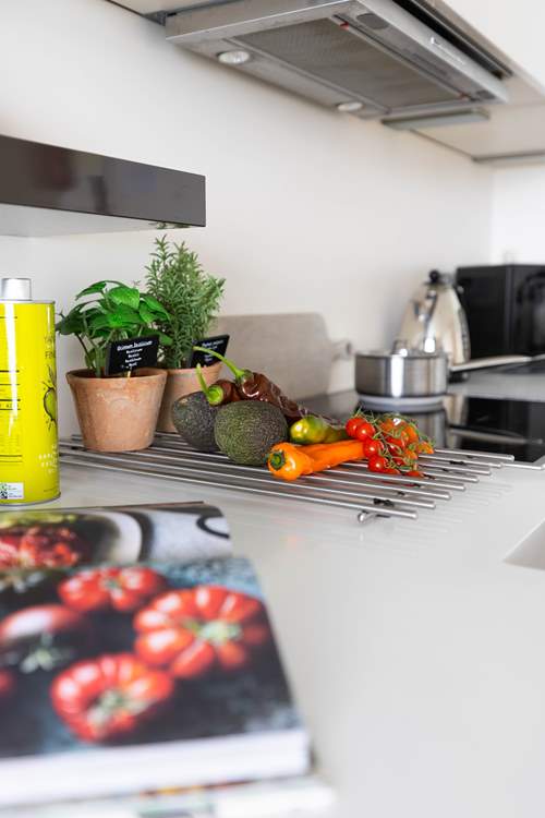 The kitchen invites you to cook up a feast, with high end design and chef-approved features.