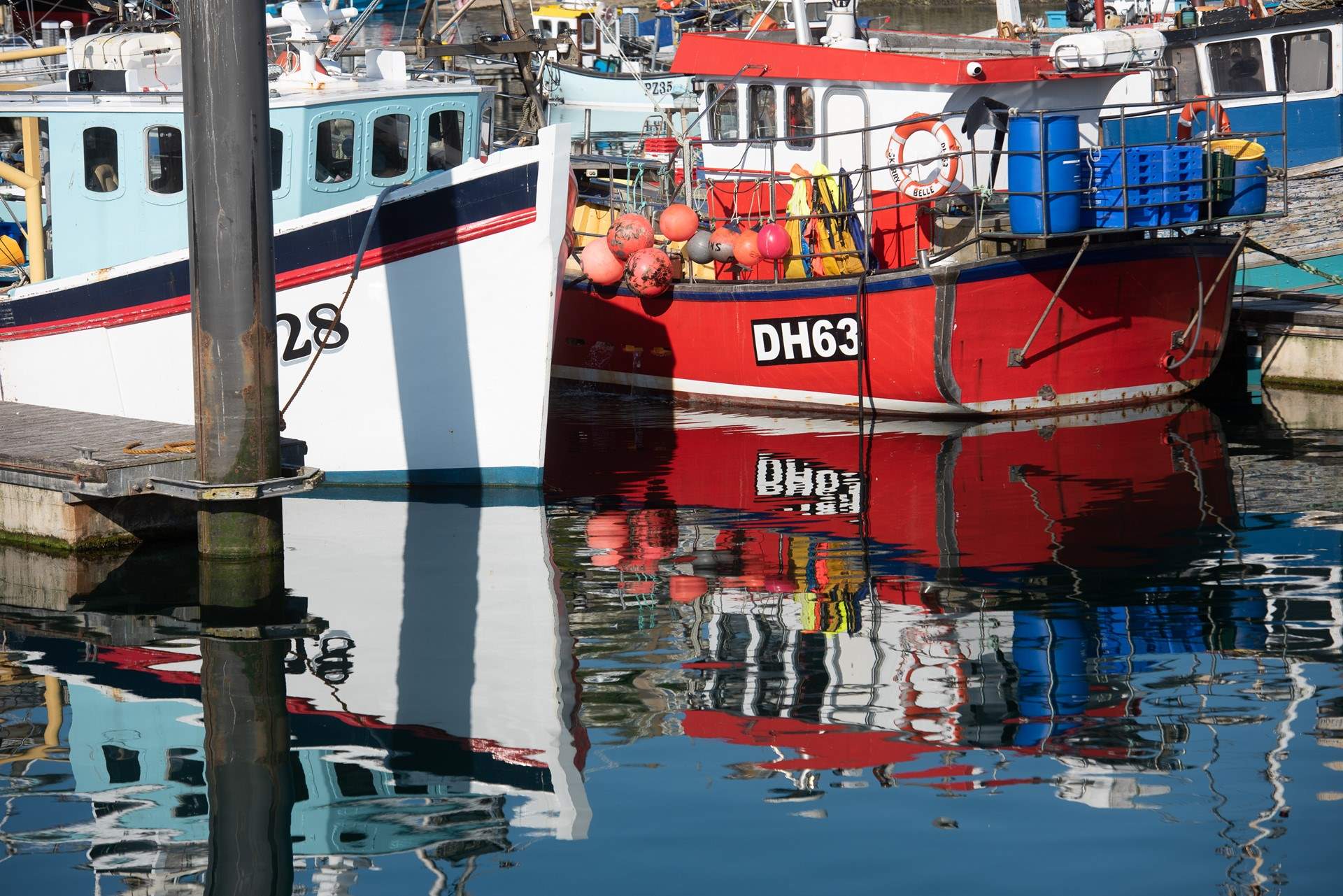 Bustling Newlyn harbour, buy the freshest catch of the day, landed by the traditional fishing boats.