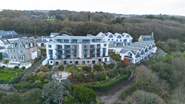 The contemporary block of 16 apartments with access down to the Cornish coast.