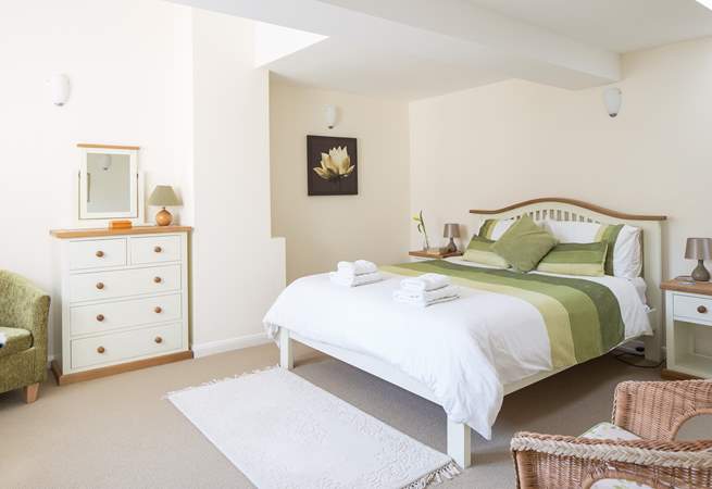 This is bedroom 2 with a king-sized bed and lots of storage space.