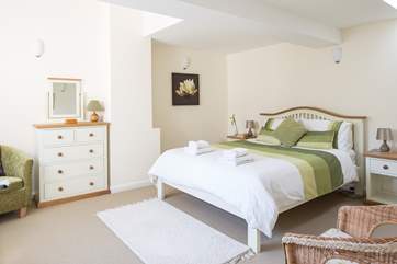 This is bedroom 2 with a king-sized bed and lots of storage space.