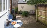 There are two private enclosed courtyard gardens to sit out in, this one is at the rear of the cottage. - Thumbnail Image