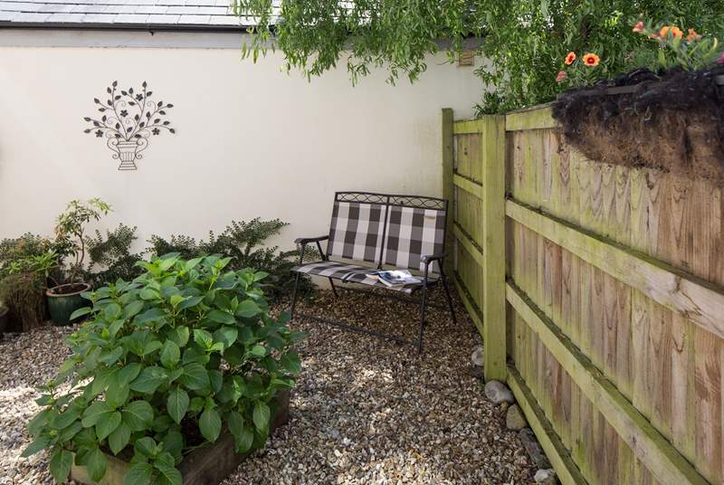 This little courtyard at the rear of the cottage is the perfect place to relax with a good book.