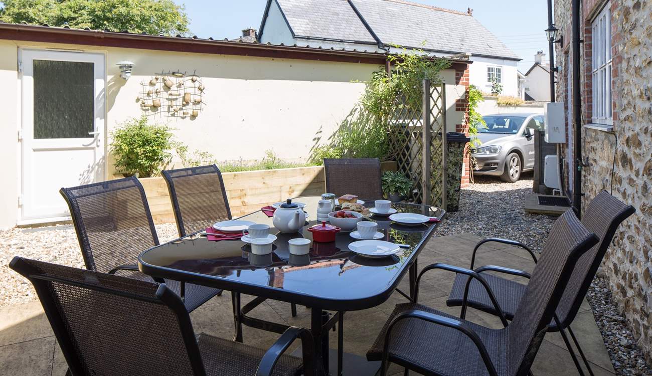Another view of the courtyard, showing the parking space and door to the garage games-room.