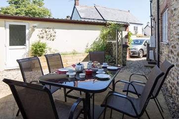 Another view of the courtyard, showing the parking space and door to the garage games-room.