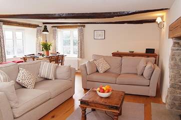 The open plan sitting-room overlooks the lovely enclosed garden.