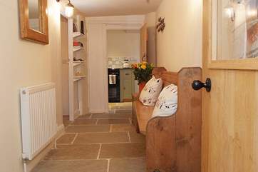 Coming in through the garden-room, the hall is as prettily presented as the rest of the house.