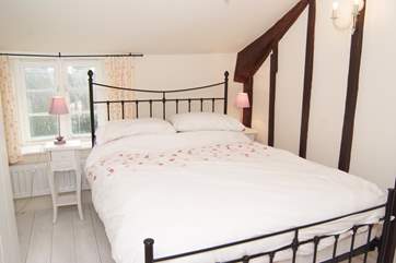 This bedroom also has a double bed and overlooks the garden.