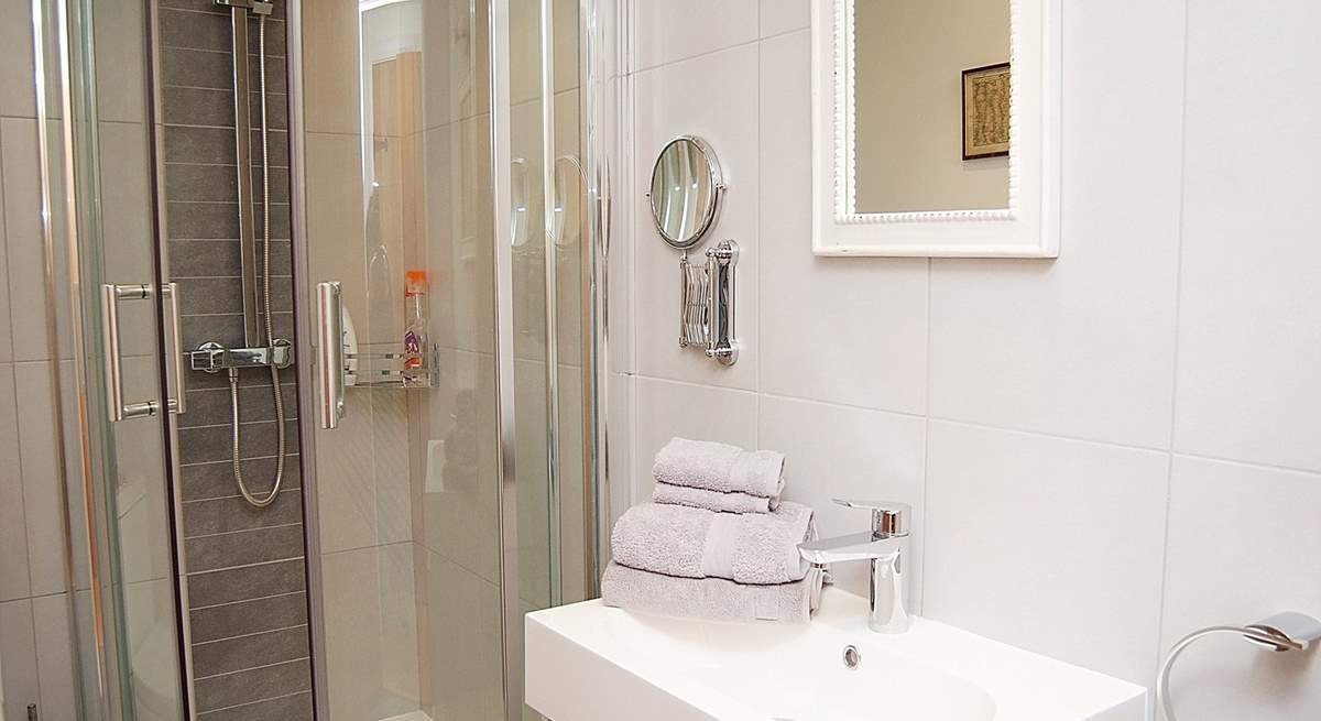 The fresh white shower-room for Bedroom 1.